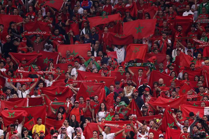 Morocco fans hold up their country's flag