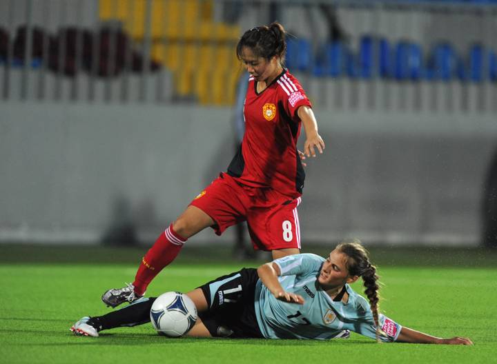 Jiahui Lei of China PR is tackled by Sabrina Soravilla of Uruguay 