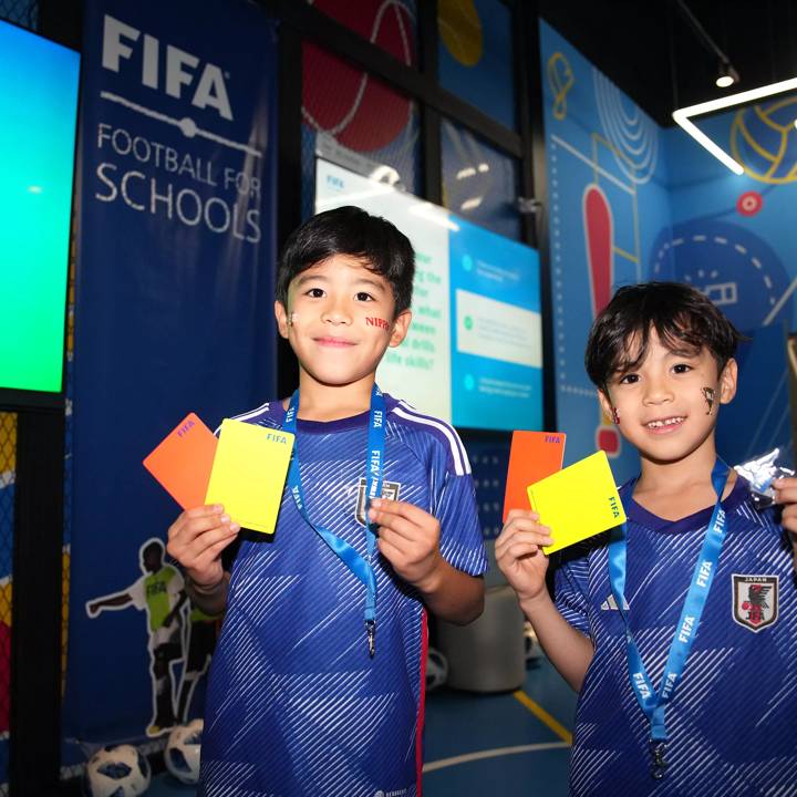 DOHA, QATAR - DECEMBER 05: Two kids with the shirt of Japan are seen 
 during the Football for Schools Activities for Children event on December 05, 2022 in Doha, Qatar. (Photo by Alex Caparros - FIFA/FIFA via Getty Images)