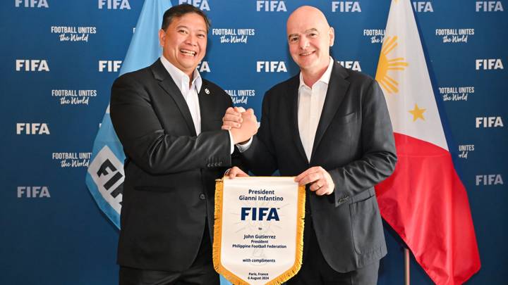 PARIS, FRANCE - AUGUST 06: FIFA President Gianni Infantino and Philippine Football Federation President John Gutierrez pose for a photo with a pennant during a meeting between FIFA and the Philippine Football Federation President at FIFA's Paris office on August 06, 2024 in Paris, France. (Photo by Harold Cunningham/FIFA)