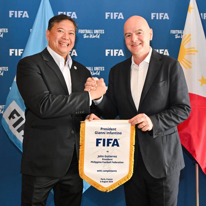 PARIS, FRANCE - AUGUST 06: FIFA President Gianni Infantino and Philippine Football Federation President John Gutierrez pose for a photo with a pennant during a meeting between FIFA and the Philippine Football Federation President at FIFA's Paris office on August 06, 2024 in Paris, France. (Photo by Harold Cunningham/FIFA)