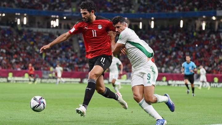 AL WAKRAH, QATAR - DECEMBER 07: Ahmed Hegazy of Egypt battles for possession with Baghdad Bounedjah of Algeria during the FIFA Arab Cup Qatar 2021 Group D match between Algeria and Egypt at Al Janoub Stadium on December 07, 2021 in Al Wakrah, Qatar. (Photo by David Ramos - FIFA/FIFA via Getty Images)