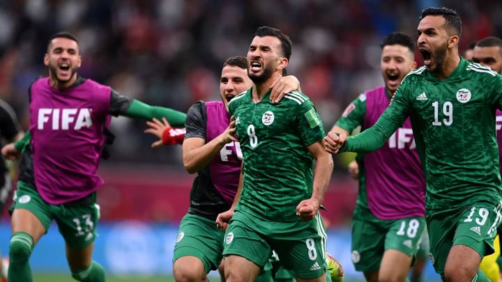 AL KHOR, QATAR - DECEMBER 18: Amir Sayoud of Algeria celebrates with teammate Abdelkader Bedrane (R) after scoring their team's first goal during the FIFA Arab Cup Qatar 2021 Final match between Tunisia and Algeria at Al Bayt Stadium on December 18, 2021 in Al Khor, Qatar. (Photo by David Ramos - FIFA/FIFA via Getty Images)