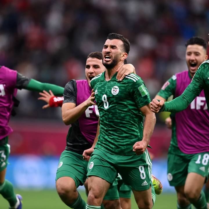 AL KHOR, QATAR - DECEMBER 18: Amir Sayoud of Algeria celebrates with teammate Abdelkader Bedrane (R) after scoring their team's first goal during the FIFA Arab Cup Qatar 2021 Final match between Tunisia and Algeria at Al Bayt Stadium on December 18, 2021 in Al Khor, Qatar. (Photo by David Ramos - FIFA/FIFA via Getty Images)