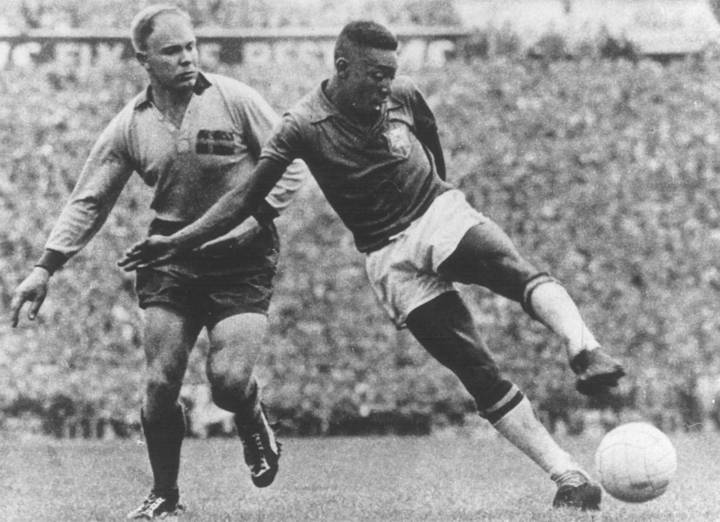 Pele of Brazil takes on a Sweden defender in the 1958 FIFA World Cup Final