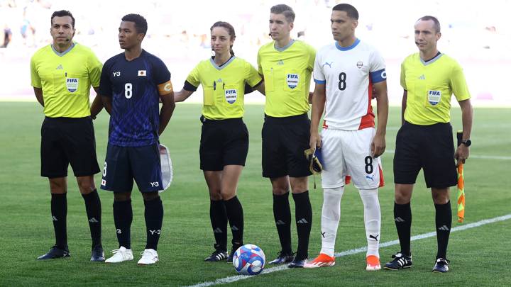 BORDEAUX, FRANCE - JULY 24: Joel Chima Fujita #8 of Team Japan and Diego Gomez #8 of Team Paraguay meet with referees during the Men's group D match between Japan and Paraguay during the Olympic Games Paris 2024 at Nouveau Stade de Bordeaux on July 24, 2024 in Bordeaux, France. (Photo by Tim Nwachukwu - FIFA/FIFA via Getty Images)