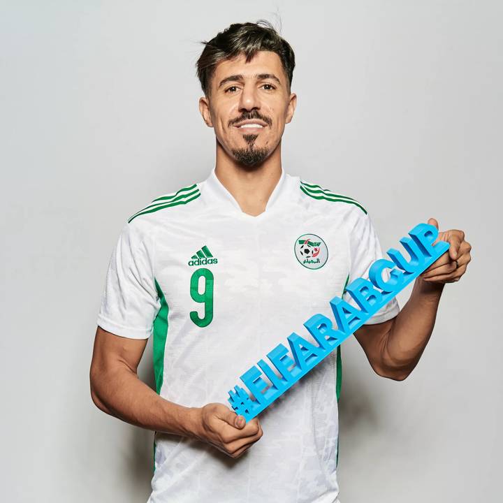 DOHA, QATAR - NOVEMBER 28: Baghdad Bounedjah of Algeria poses during the Algeria team presentation prior to the FIFA Arab Cup Qatar 2021 at Grand Hyatt Doha Hotel on November 28, 2021 in Doha, Qatar. (Photo by Michael Regan - FIFA/FIFA via Getty Images)