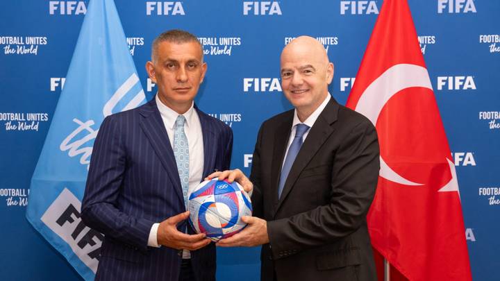 PARIS, FRANCE - JULY 30: FIFA President Gianni Infantino and Turkish Football Federation President Ibrahim Ethem Haciosmanoglu pose for a photo with an Olympic Games Paris 2024 official match ball during a meeting between FIFA and meeting with Turkish Football Federation at FIFA's Paris office on July 30, 2024 in Paris, France. (Photo by Léo-Paul Ridet/FIFA)