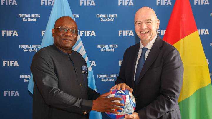 PARIS, FRANCE - AUGUST 1: FIFA President Gianni Infantino and Guinean Football Federation President Bouba Sampil pose with an Olympic Games Paris 2024 official match ball during a meeting between FIFA and the Guinean Football Federation and Minstry of Sport at FIFA's Paris office on August 1, 2024 in Paris, France. (Photo by Alex Grimm- FIFA/FIFA via Getty Images)