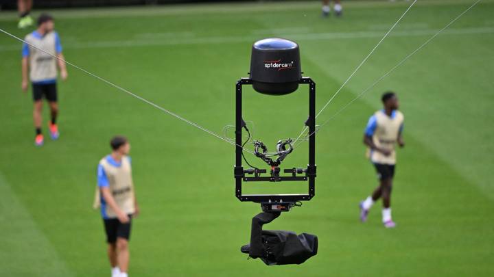 A television camera hangs with a spidercam, cable-suspended camera system, on top of the national stadium during a training session on the eve of the UEFA Super Cup football match Real Madrid v Atalanta Bergamo in Warsaw, Poland, on August 13, 2024. The 2024 UEFA Super Cup final football match between Real Madrid and Atalanta will be held on August 14, 2024 at the National Stadium in Warsaw. (Photo by Sergei GAPON / AFP) (Photo by SERGEI GAPON/AFP via Getty Images)