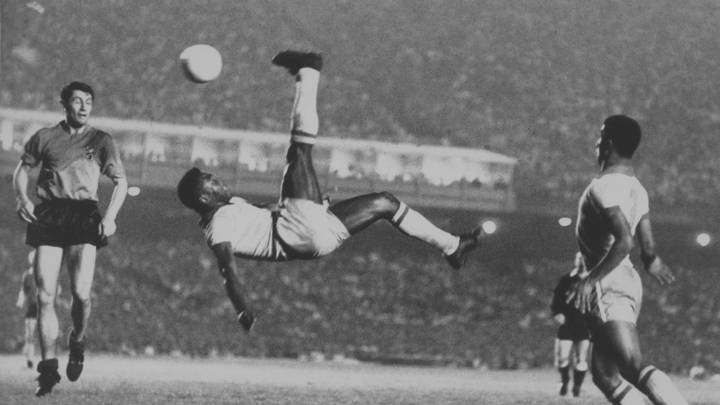 Brazilian footballer Pelé makes an attempt on goal with an athletic overhead kick during a Friendly International at the Maracana Stadium in Rio de Janeiro, Brazil, 2nd June 1965. Brazil won the match 5-0. (Photo by Popperfoto via Getty Images/Getty Images)