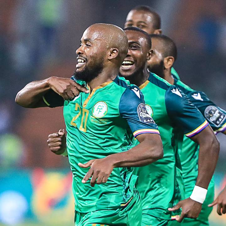 Comoros' forward Ahmed Mogni  (L) celebrates after scoring his team's second goal during the Group C Africa Cup of Nations (CAN) 2021 football match between Ghana and Comoros at Stade Roumde Adjia in Garoua on January 18, 2022. (Photo by Daniel BELOUMOU OLOMO / AFP) (Photo by DANIEL BELOUMOU OLOMO/AFP via Getty Images)