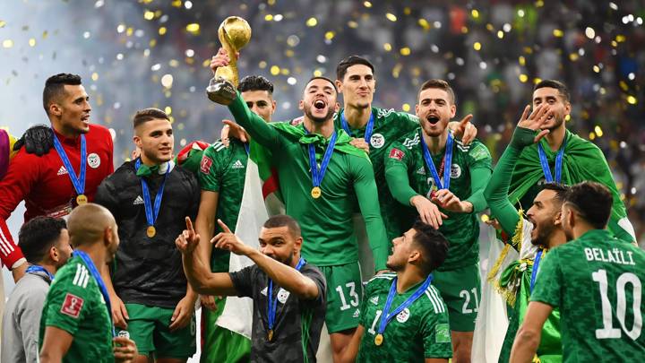 AL KHOR, QATAR - DECEMBER 18: Merouane Zerrouki of Algeria  lifts the FIFA Arab Cup trophy following victory during the FIFA Arab Cup Qatar 2021 Final match between Tunisia and Algeria at Al Bayt Stadium on December 18, 2021 in Al Khor, Qatar. (Photo by Michael Regan - FIFA/FIFA via Getty Images)