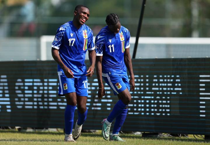 Godame Tieri of Central African Republic celebrates with Baboula Ghislain 