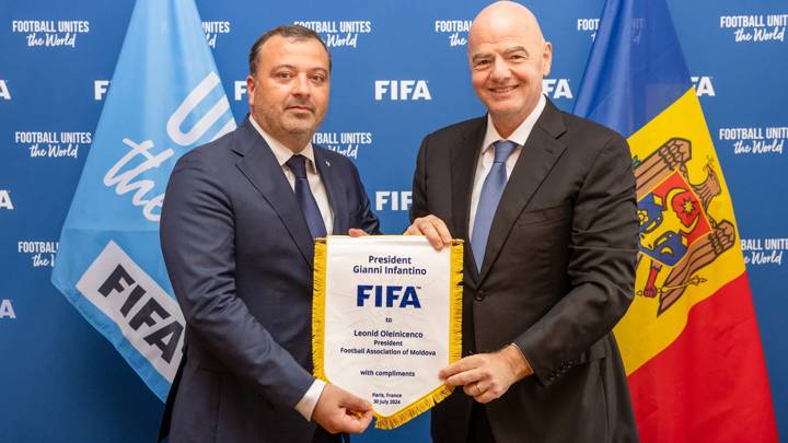 PARIS, FRANCE - JULY 30: FIFA President Gianni Infantino presents pennant to Moldovan Football Federation President Leonid Oleinicenco during a meeting between FIFA and the Moldovan Football Federation at FIFA's Paris office on July 30, 2024 in Paris, France. (Photo by Léo-Paul Ridet/FIFA)