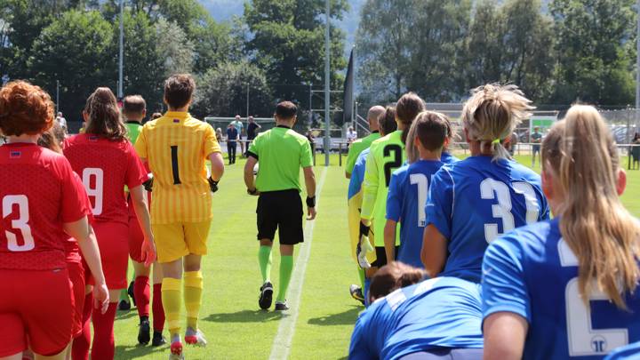 Zhytlobud-1 Kharkiv U21 and Liechtenstein WNT walk onto the pitch