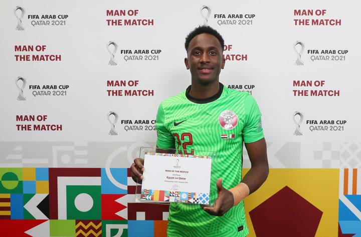 Meshaal Barsham of Qatar receives the Man of the Match award following the FIFA Arab Cup Qatar 2021 3rd Place Match between Egypt and Qatar.