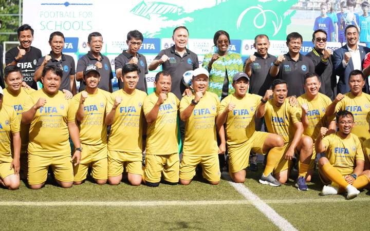 Attendees pose for a photo during a Football for Schools course in Indonesia