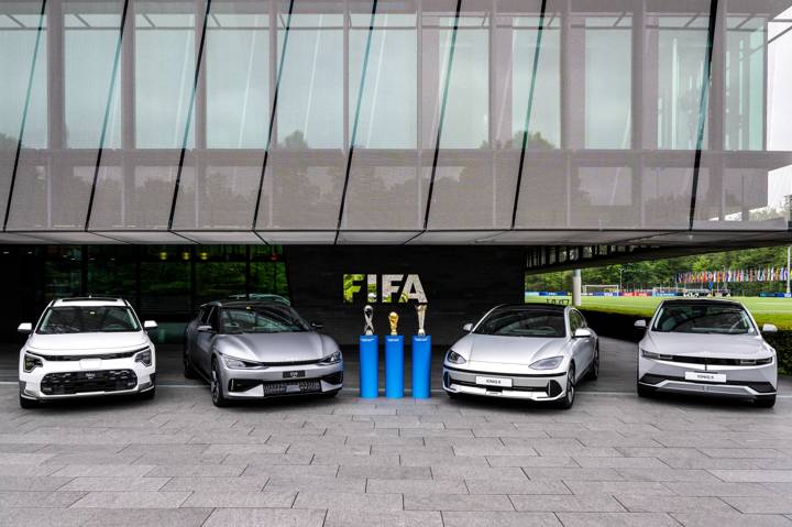 A view of the FIFA U-17 World Cup 2023 Winner's Trophy, FIFA World Cup 26 Winner's Trophy and the FIFAe World Cup 2023 Winner's Trophy alongside the Kia Niro, Kia EV6, Hyundai IONIQ 6 and Hyundai IONIQ 5 