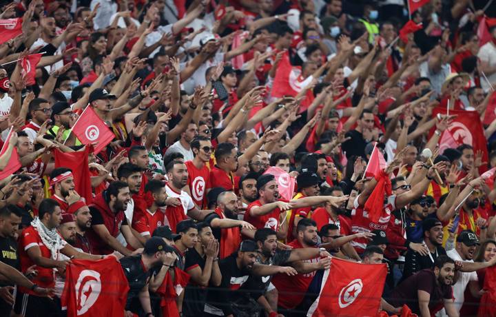 Fans show their support during  the FIFA Arab Cup Qatar 2021 Semi-Final match between Tunisia and Egypt.