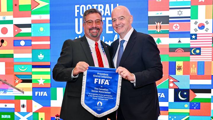 PARIS, FRANCE - JULY 22: FIFA President Gianni Infantino and The Canadian Soccer Association President Peter Augruso pose for a photo with pennant during the Celebratory Lunch on the sidelines of the Olympic Games Paris 2024 at FIFA Paris offices on July 22, 2024 in Paris, France. (Photo by Harold Cunningham/FIFA)