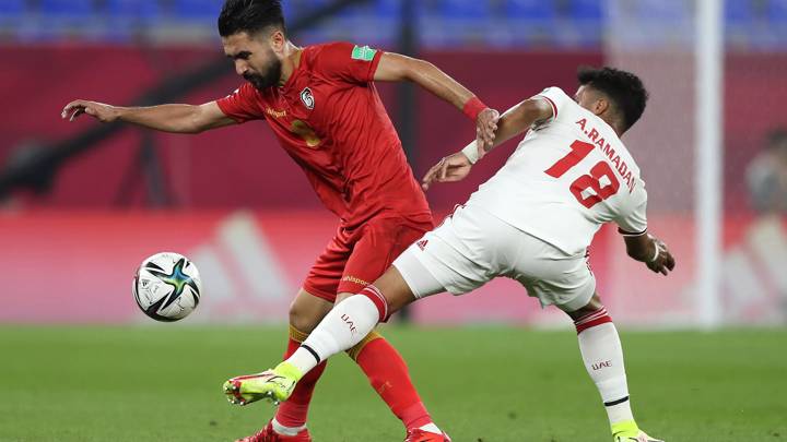 DOHA, QATAR - NOVEMBER 30: Ward Alslamh of Syria and Abdalla Ramadan of United Arab Emirates battle for the ball during the FIFA Arab Cup Qatar 2021 Group B match between United Arab Emirates and Syria at Stadium 974 on November 30, 2021 in Doha, Qatar. (Photo by Mohamed Farag - FIFA/FIFA via Getty Images)