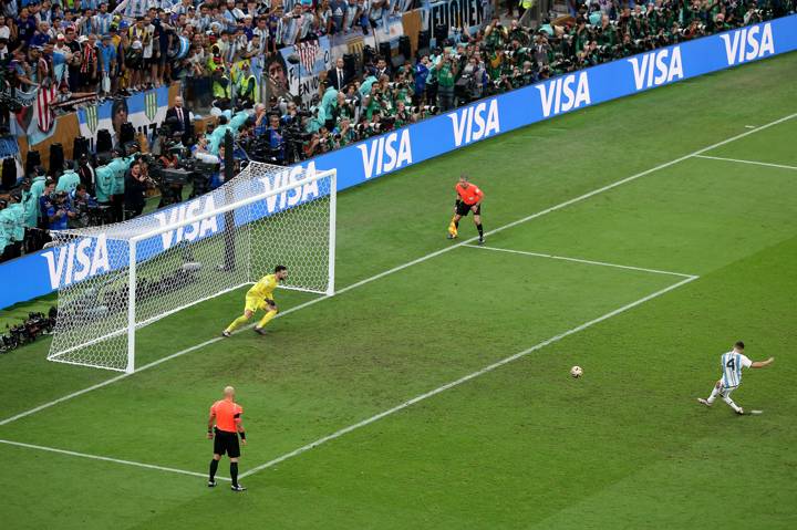 Gonzalo Montiel of Argentina scores their penalty during the penalty shootout as Hugo Lloris of France attempts to make a save during the FIFA World Cup Qatar 2022 Final 