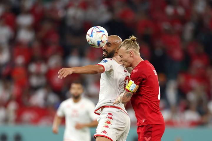 AL RAYYAN, QATAR - NOVEMBER 22: Issam Jebali of Tunisia is challenged by Simon Kjaer of Denmark during the FIFA World Cup Qatar 2022 Group D match between Denmark and Tunisia at Education City Stadium on November 22, 2022 in Al Rayyan, Qatar. (Photo by Lars Baron/Getty Images)