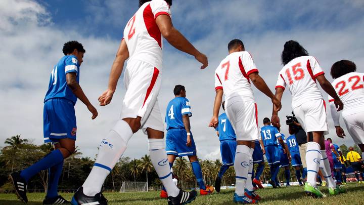 The teams come out to the field. OFC's 2018 FIFA World Cup Russia Qualifier Stage 1, Match Day Two, American Samoa v Tonga, Loto-Tonga Soka Centre, Tonga, Wednesday 2nd September 2015. Photo: Shane Wenzlick / www.phototek.nz