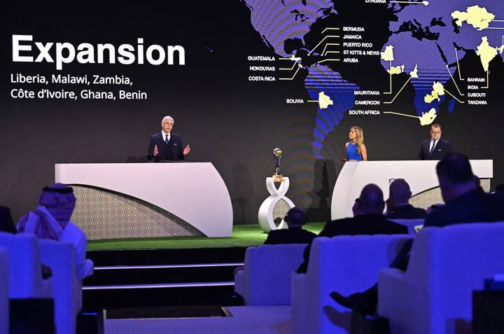 FIFA Chief of Global Football Development Arsène Wenger (L) speaks on stage during FIFA Football Summit 2023