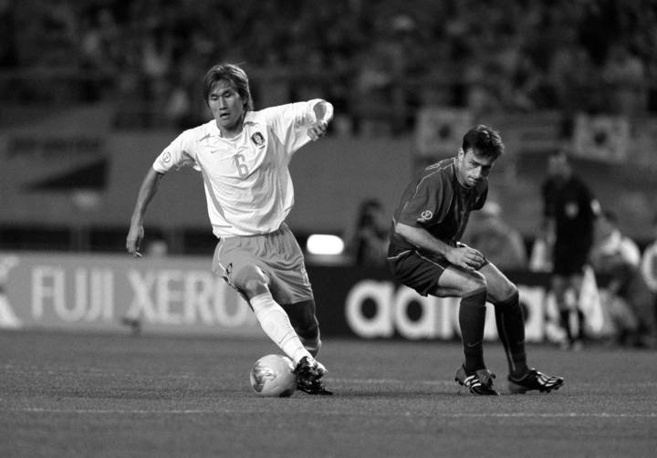 Korea Republic's Yoo Sang Chul beats Portugal's Paulo Bento during the 2002 FIFA World Cup