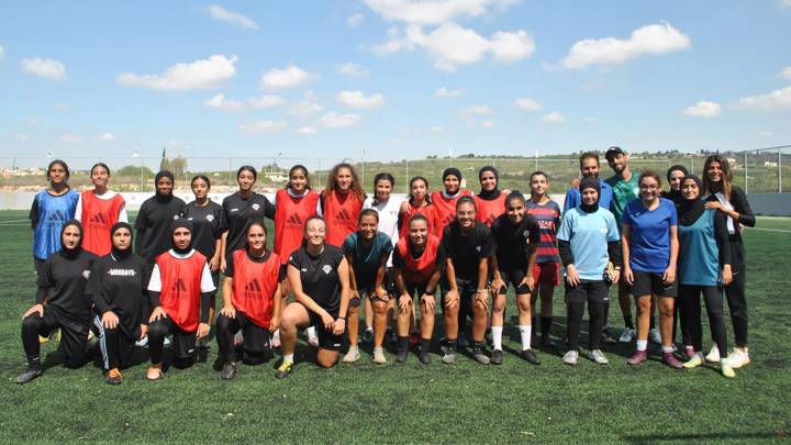 Super Girls FC players pose for a group photo after their training in Aabbassiye, Lebanon.