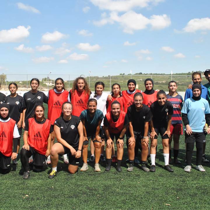 Super Girls FC players pose for a group photo after their training in Aabbassiye, Lebanon.