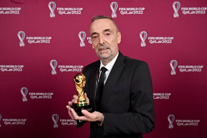 uan C. Scelza with a World Cup replica trophy