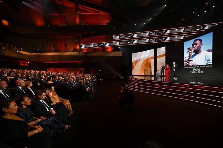 FIFA President Gianni Infantino on stage alongside Presenters Jermaine Jenas (L) and Samantha Johnson (C) during The Best FIFA Football Awards 2022