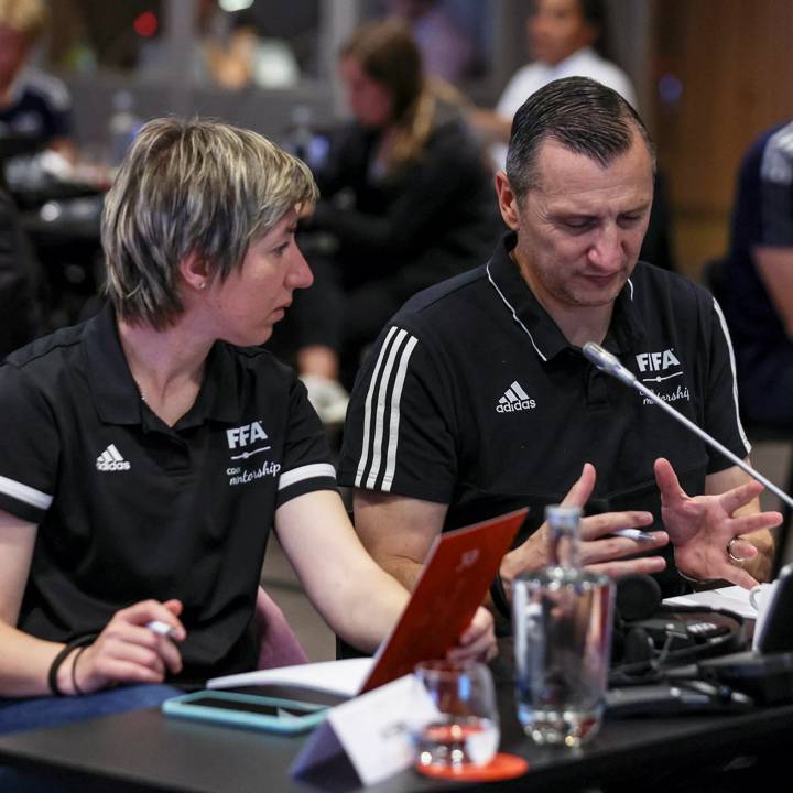 LISBON, PORTUGAL - MAY 23: Vlatko Andonovski United States of America Women's National Team Head Coach (R) talks with Katerina Miles - Head Coach of Macedonias U17 Womens National Team (L) during the FIFA Coach Mentorship programme workshop at Cidade de Futebol on May 23, 2023 in Lisbon, Portugal. (Photo by Carlos Rodrigues/FIFA/Getty Images)