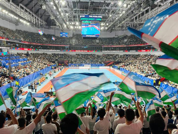 TASHKENT, UZBEKISTAN - SEPTEMBER 14: Uzbekistan fans wave flags prior to the FIFA Futsal World Cup Uzbekistan 2024 match between Uzbekistan and Netherlands at Hubo Arena on September 14, 2024 in Tashkent, Uzbekistan. (Photo by FIFA)