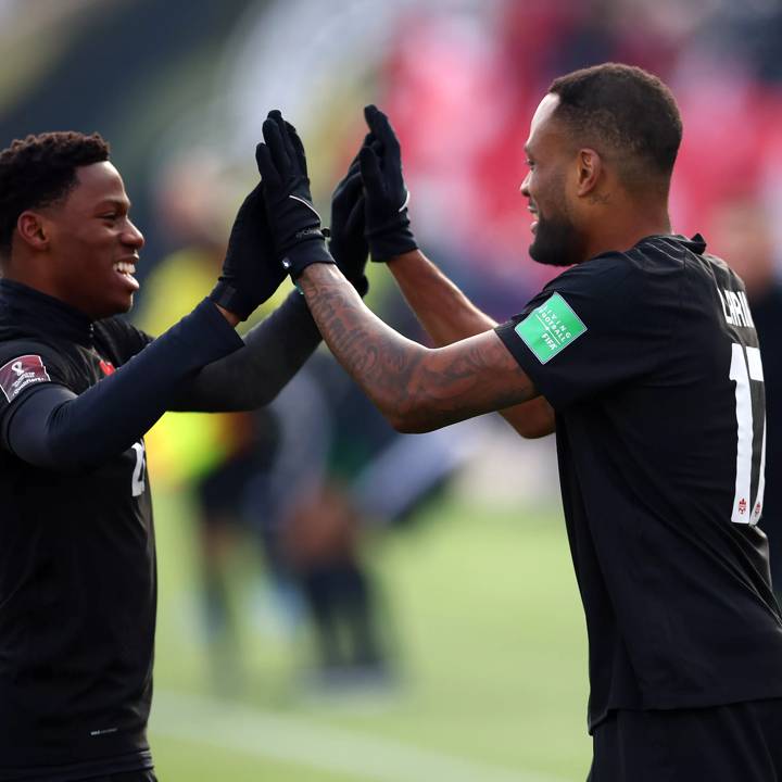 HAMILTON, ON - JANUARY 30:  Cyle Larin #17 (R) of Canada celebrates his goal with Jonathan David #20 during a 2022 World Cup Qualifying match against the United States at Tim Hortons Field on January 30, 2022 in Hamilton, Ontario, Canada.  (Photo by Vaughn Ridley/Getty Images)