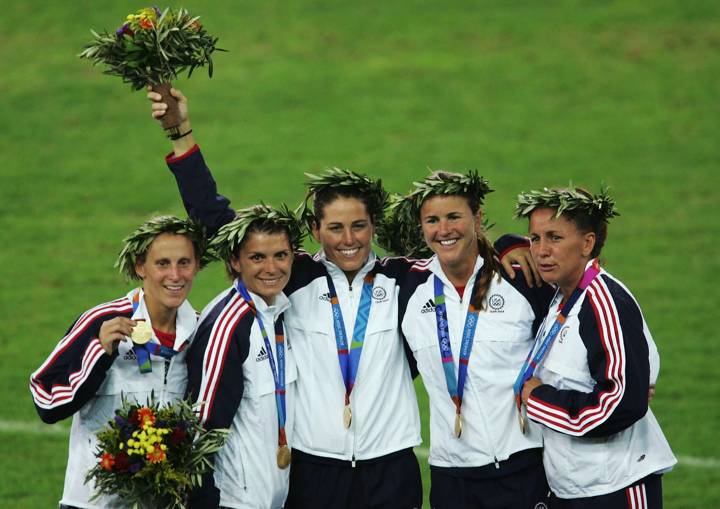 Members of the victorious USA team that beat Brazil 2-1 in extra time stand with their medals on the podium after the women's football match played between Brazil and the USA on August 26, 2004 during the Athens 2004 Summer Olympic Games 