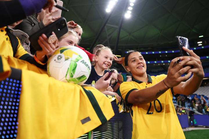 Sam Kerr poses for a selfie with fans after the match between Australia and Canada at the new Sydney Football Stadium