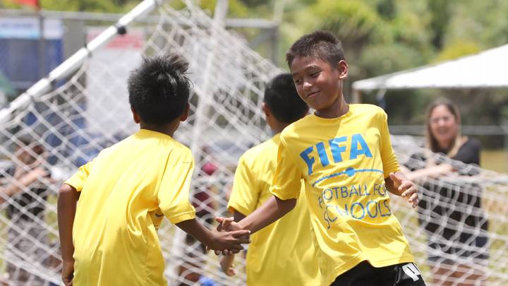 HARMON, GUAM – MAY 07: Talofofo Elementary School students celebrate a goal against the Bishop Baumgartner Memorial Catholic School during the FIFA Football 4 Schools Festival Jamboree at the Guam Football Association National Training Center on May 7, 2022 in Harmon, Guam. (Photo by Jill Espiritu/Guam Football Association)