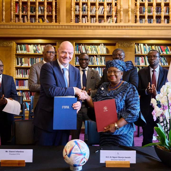 GENEVA, SWITZERLAND- SEPTEMBER 27: FIFA President Gianni Infantino and World Trade Organization (WTO) Director-General Ngozi Okonjo-Iweala sign a Memorandum of Understanding (MoU) aside the during the World Trade Organization (WTO) Public Forum'22 on September 27, 2022 in Geneva, Switzerland. (Photo by Von Siebenthal Loris/WTO)