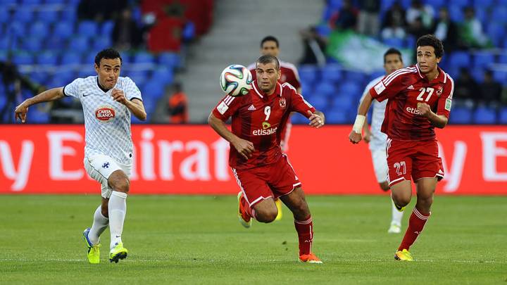 Al Ahly's Emad Moteab and Monterrey's Lobes Leobardo (L) run for the ball during the FIFA Club World Cup match between Egypt's Al Ahly and Mexico's CF Monterrey in Marrakesh, Morocco on December 18, 2013