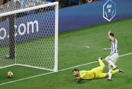 Messi pokes the ball over the line