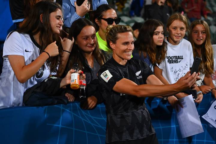  Hannah Wilkinson of New Zealand takes selfies with fans 