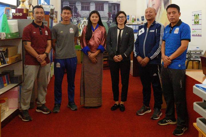 Pema Choden Tshering (L3) , head of BFF Women's Football, takes a picture with visiting AFC Head of Women's Football Bai Lili (L4)