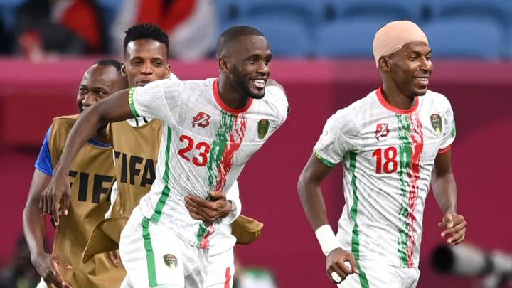 AL WAKRAH, QATAR - DECEMBER 06: Mohamed Soueid of Mauritania celebrates with teammates after scoring their team's first goal during the FIFA Arab Cup Qatar 2021 Group B match between Syria and Mauritania at Al Janoub Stadium on December 06, 2021 in Al Wakrah, Qatar. (Photo by Michael Regan - FIFA/FIFA via Getty Images)