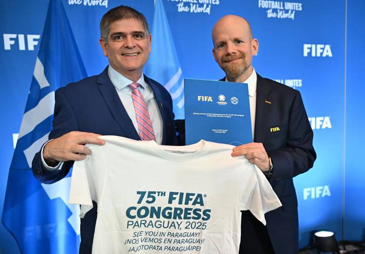 FIFA Secretary General Mattias Grafström (R) and CONMEBOL General Secretary José Astigarraga pose for a photo