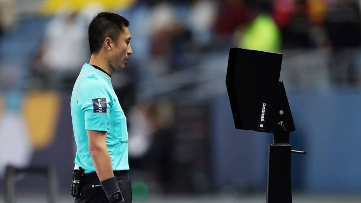 TANGER MED, MOROCCO - FEBRUARY 01: Referee Ma Ning checks the Video Assistant Referee and later overturns a penalty during the FIFA Club World Cup Morocco 2022 1st Round match between Al Ahly FC and Auckland City FC at Stade Ibn-Batouta on February 01, 2023 in Tanger Med, Morocco. (Photo by Alex Grimm - FIFA/FIFA via Getty Images)