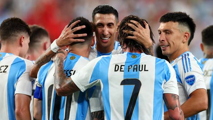 EAST RUTHERFORD, NEW JERSEY - JULY 09: Lionel Messi of Argentina celebrates after scoring the team's second goal with teammates Angel Di Maria and Rodrigo De Paul during the CONMEBOL Copa America 2024 semifinal match between Canada and Argentina at MetLife Stadium on July 09, 2024 in East Rutherford, New Jersey. (Photo by Sarah Stier/Getty Images)